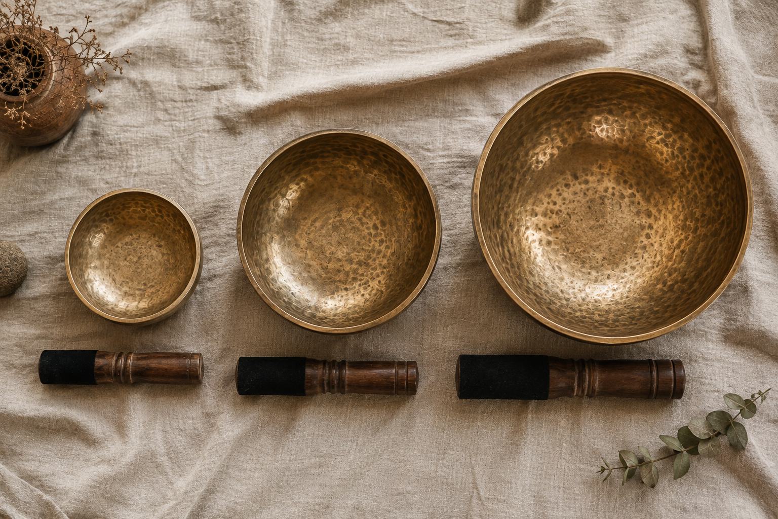 Small, medium, and large hand-hammered singing bowls for choosing the right size