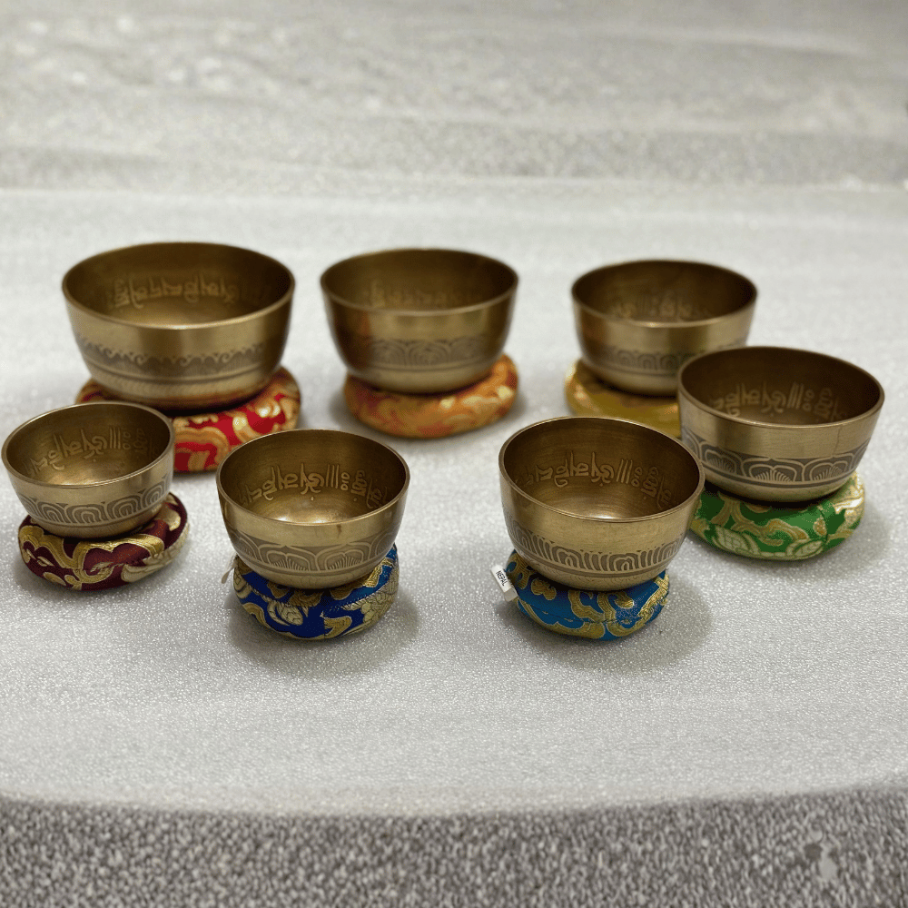 Tibetan Singing Bowl Set of 7 — Mantra Carved Bronze Chakra Bowls, Handmade in Nepal singing bowl set of 7 in travel carry case