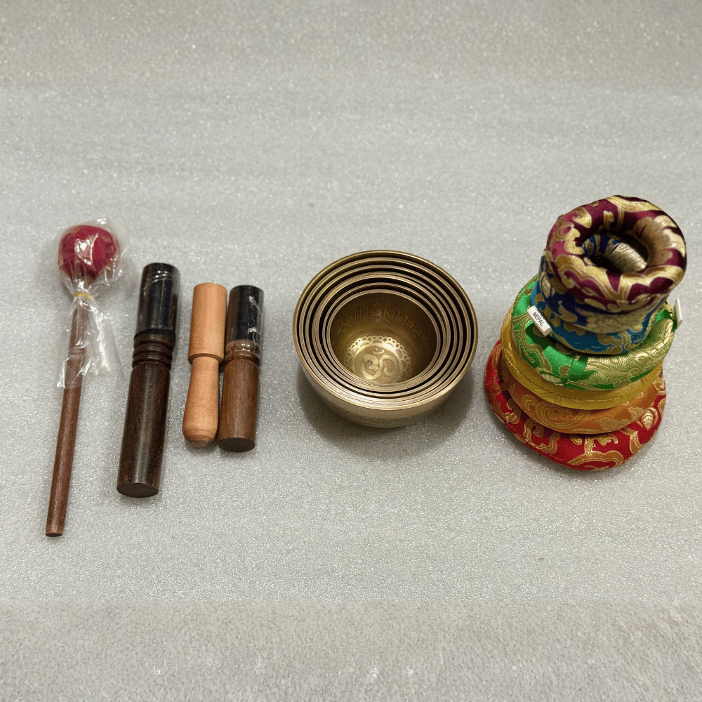 Tibetan Singing Bowl Set of 7 — Mantra Carved Bronze Chakra Bowls, Handmade in Nepal tibetan singing bowl set of 7 with mallets and cushions